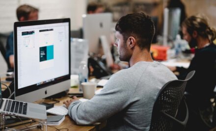 Productive and positive work culture concept image by Mimi Thian from Unsplash. 